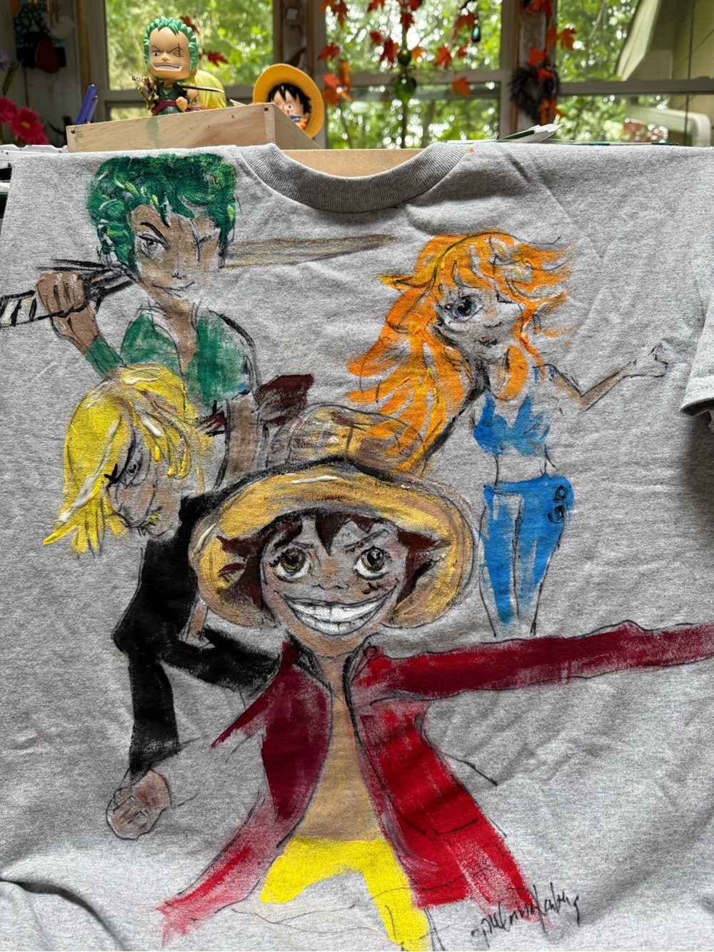 Hand-Painted Graphic Tee with Colorful Anime Crew